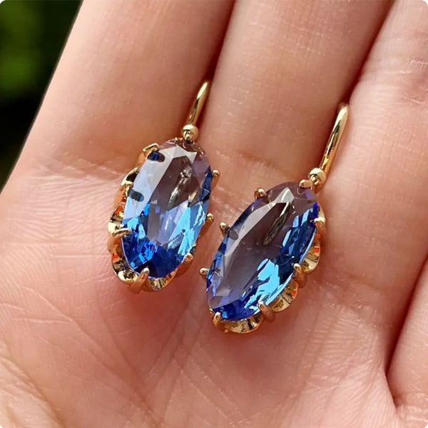 Boucles d'oreilles fleur bleue dorées