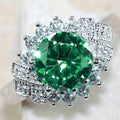 Bague Grand Halo Émeraude Imposante