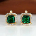 Boucles d'oreilles en or avec zirconium carré vert doré