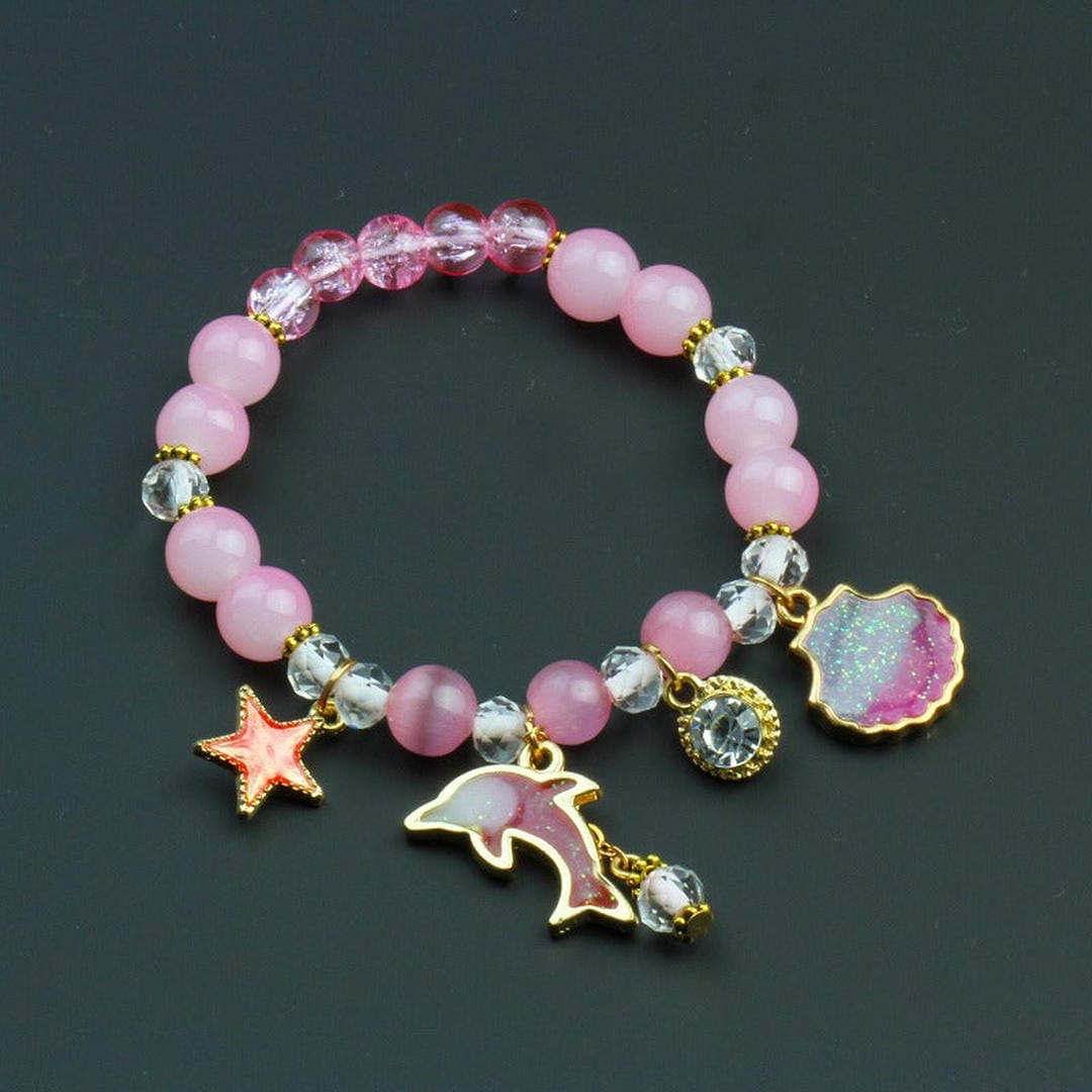 Bracelet en perles avec pendentif coquillage de dauphin