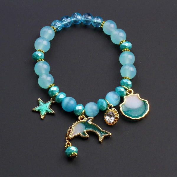 Bracelet en perles avec pendentif coquillage de dauphin