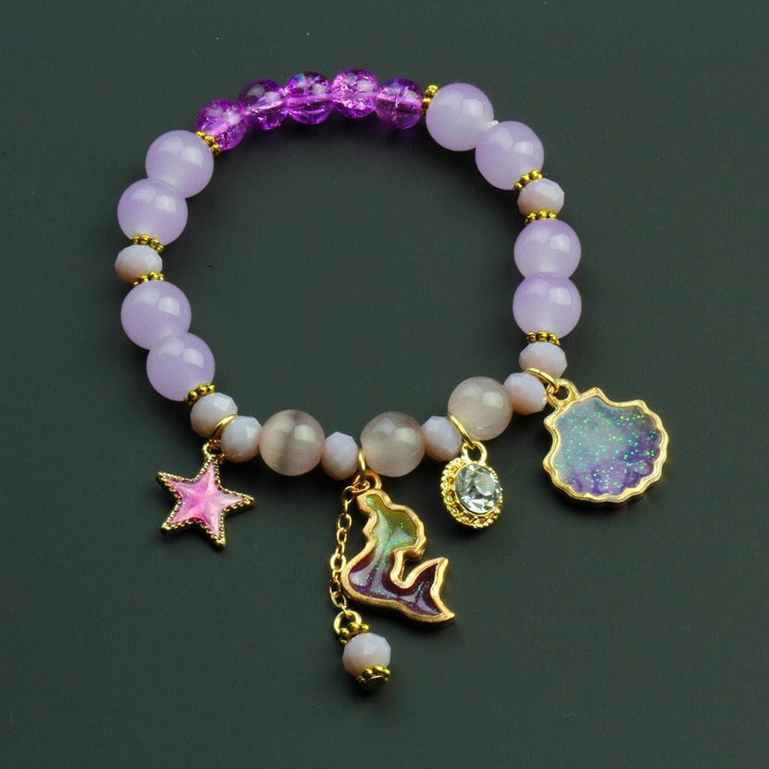 Bracelet en perles avec pendentif coquillage de dauphin