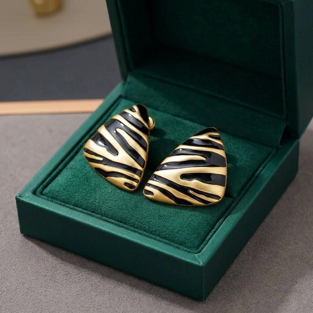 Boucles d'oreilles en forme de triangle avec des motifs de zèbre