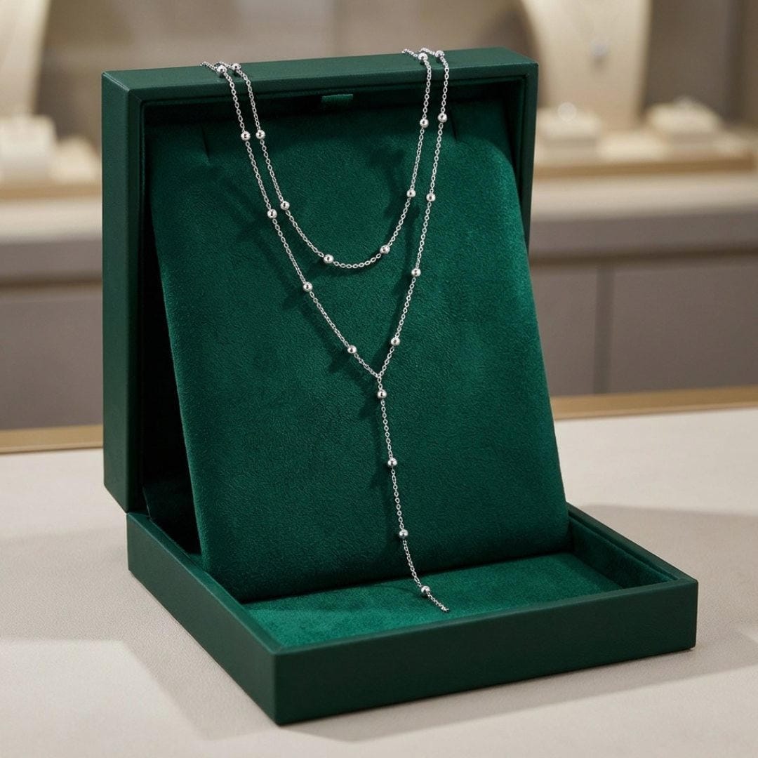 Collier long à pompons en double couche doré