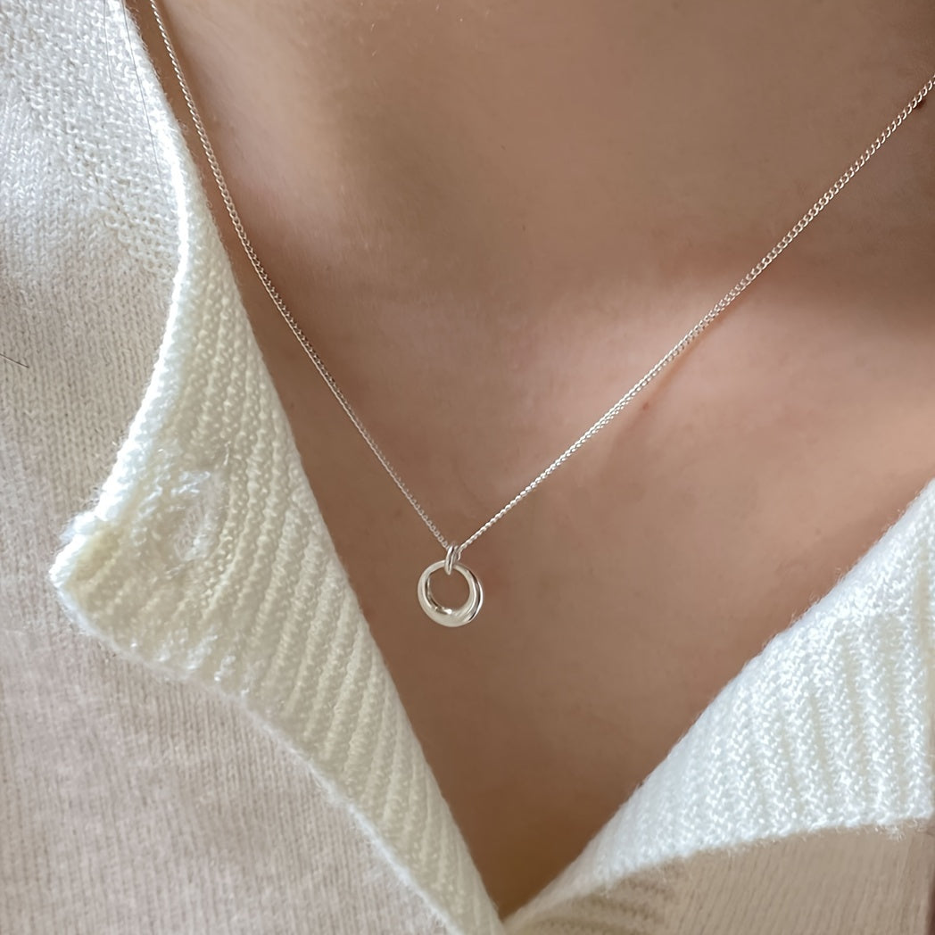 Collier pendentif cercle géométrique en or blanc