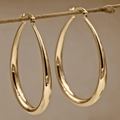 Boucles d'oreilles en anneau dorées élégantes