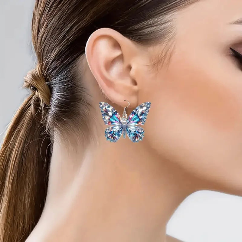 Boucles d'oreilles en forme de papillon scintillant