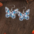 Boucles d'oreilles en forme de papillon scintillant