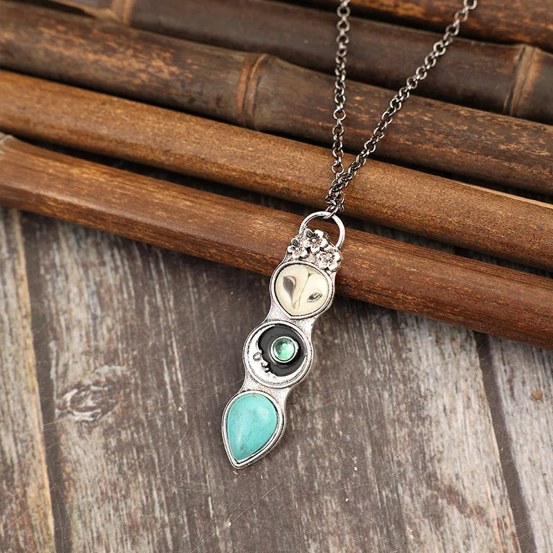 Collier barre avec un hibou turquoise de sagesse