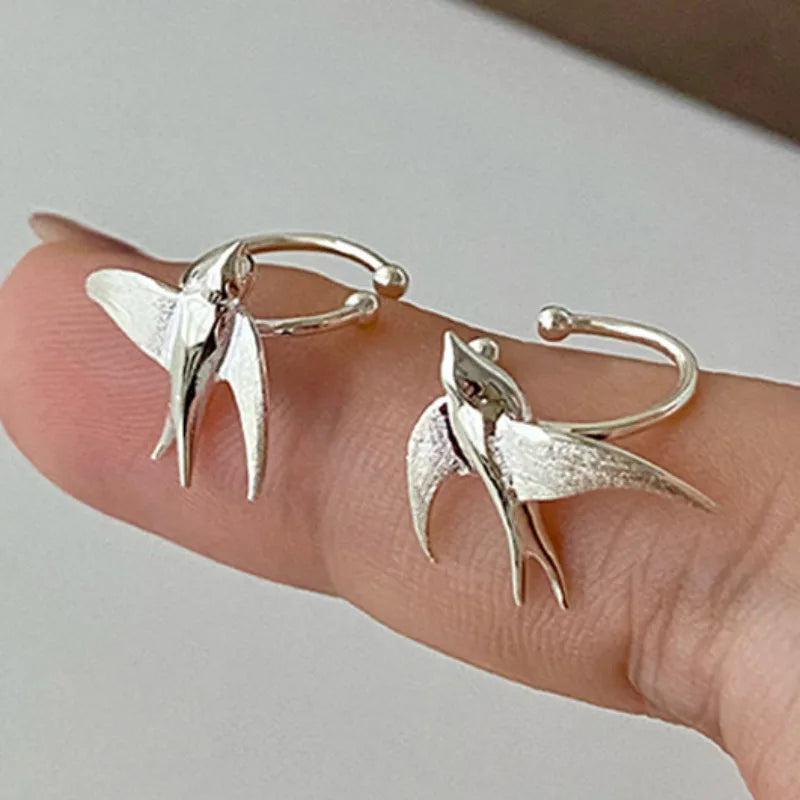 Jolies boucles d'oreilles clips en argent en forme d'hirondelle