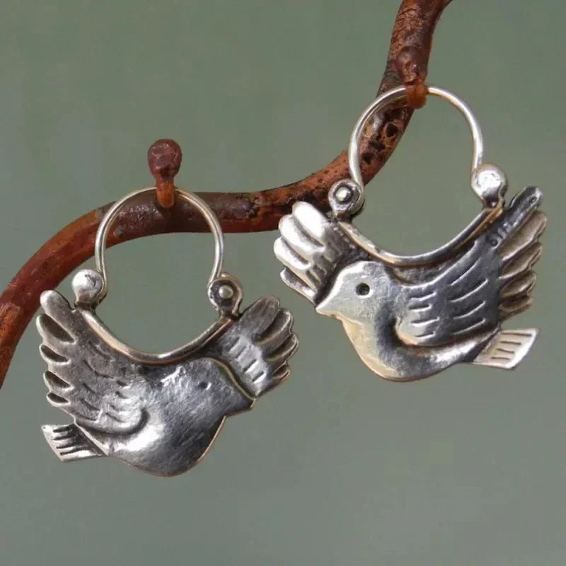 Boucles d'oreilles pendantes inspirées par un oiseau boho – couleur argentée