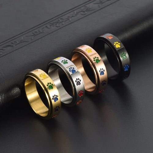 Bague en acier inoxydable en forme de patte anti-stress avec des pattes arc-en-ciel