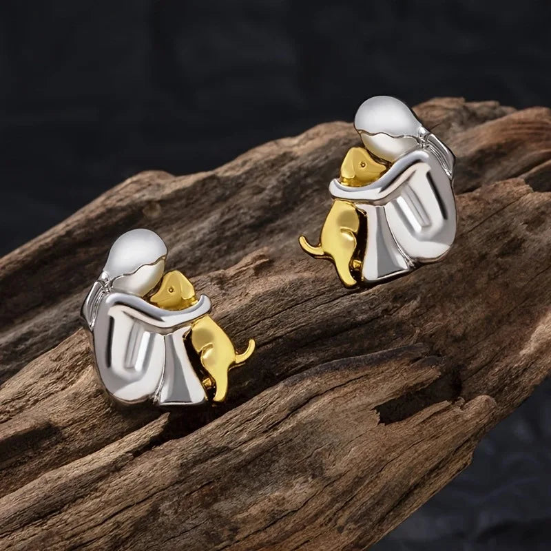 Boucles d'oreilles en argent et or bicolores en forme de câlin