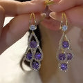Boucles d'oreilles pendantes cristal violet