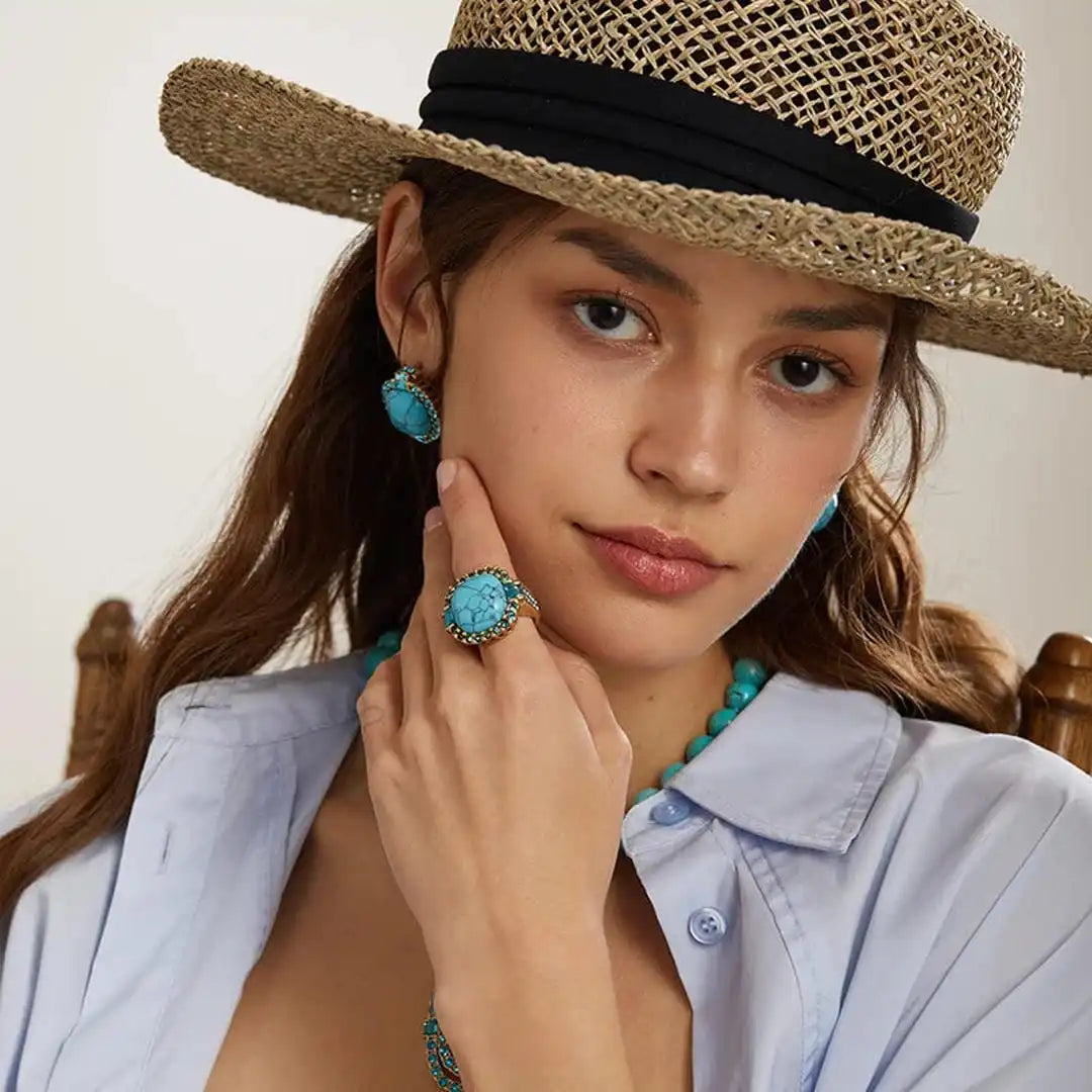 Bague en zirconium avec pierre turquoise dorée