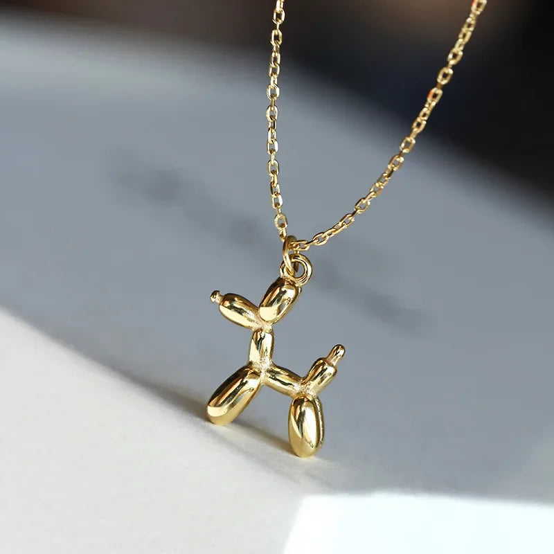 Collier pendentif en forme de chien en ballon couleur dorée