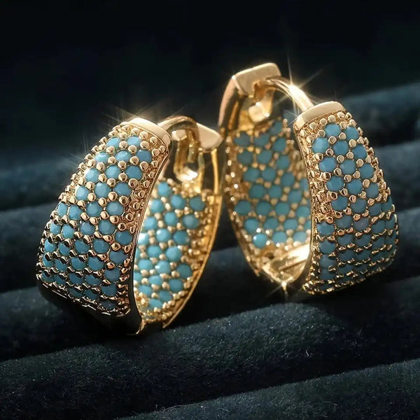 Boucles d'oreilles en anneau doré ornées de fleurs turquoise