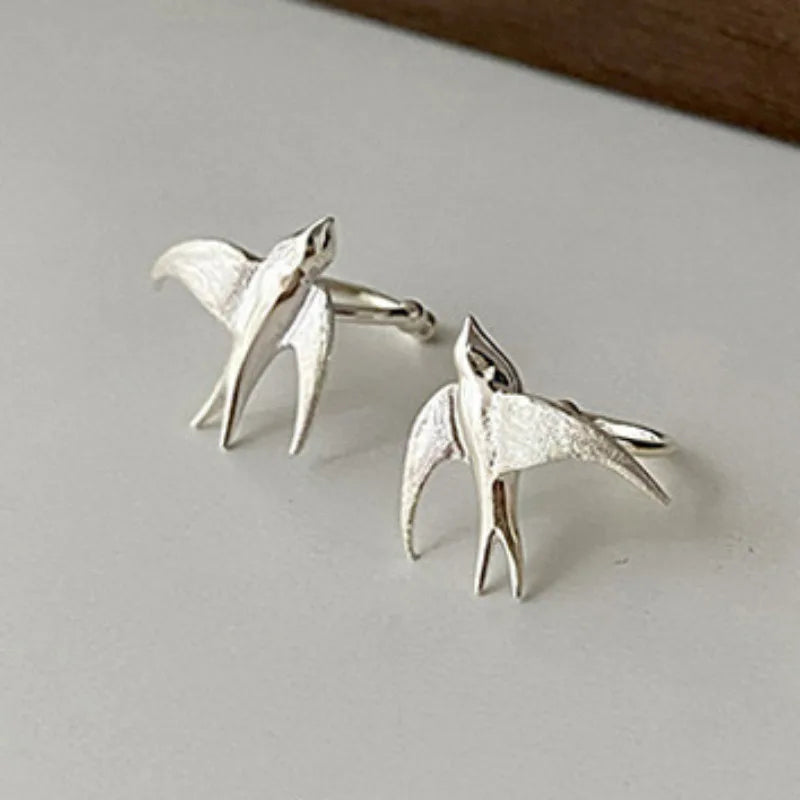 Jolies boucles d'oreilles clips en argent en forme d'hirondelle