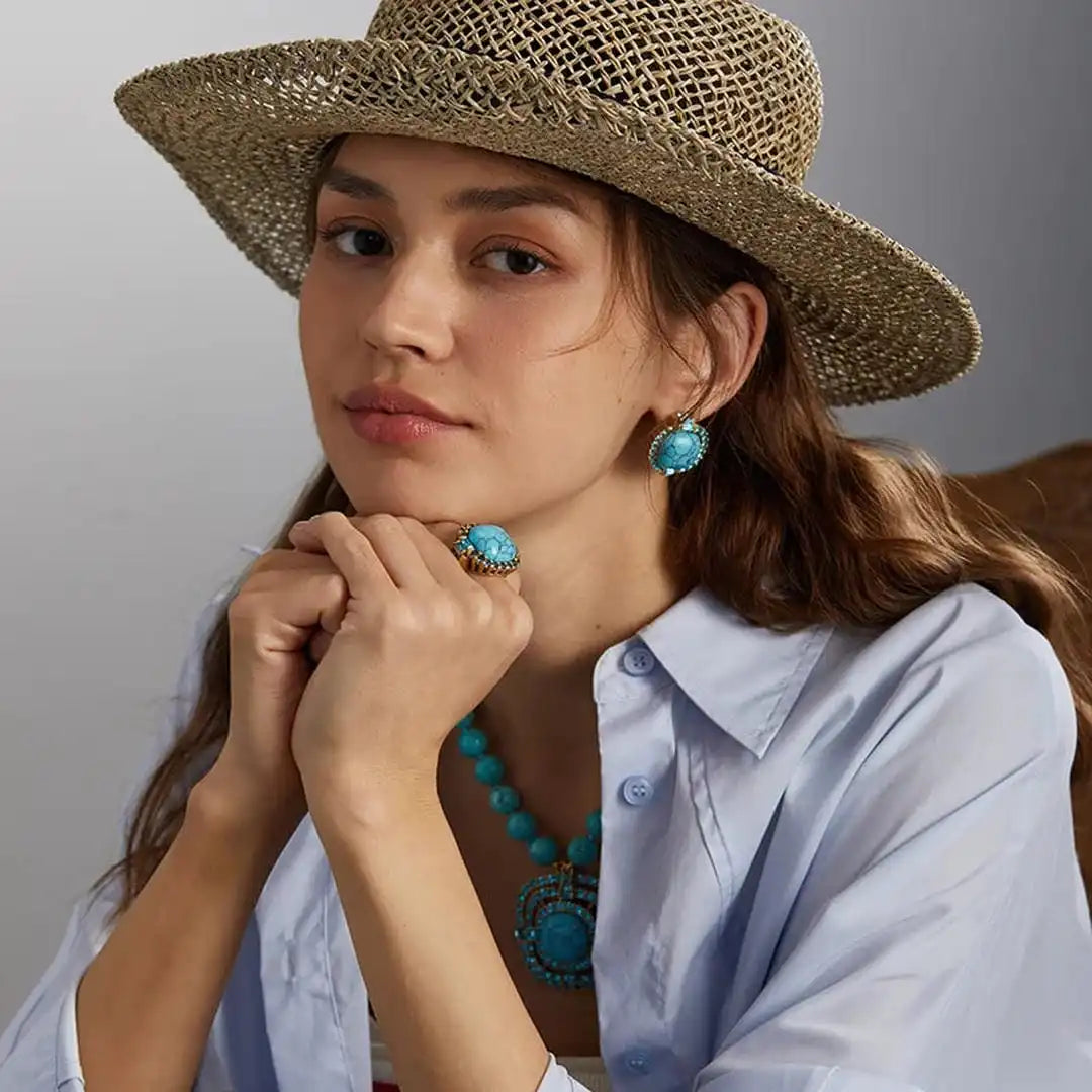 Bague en zirconium avec pierre turquoise dorée