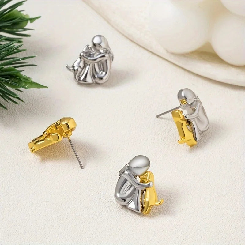 Boucles d'oreilles en argent et or bicolores en forme de câlin