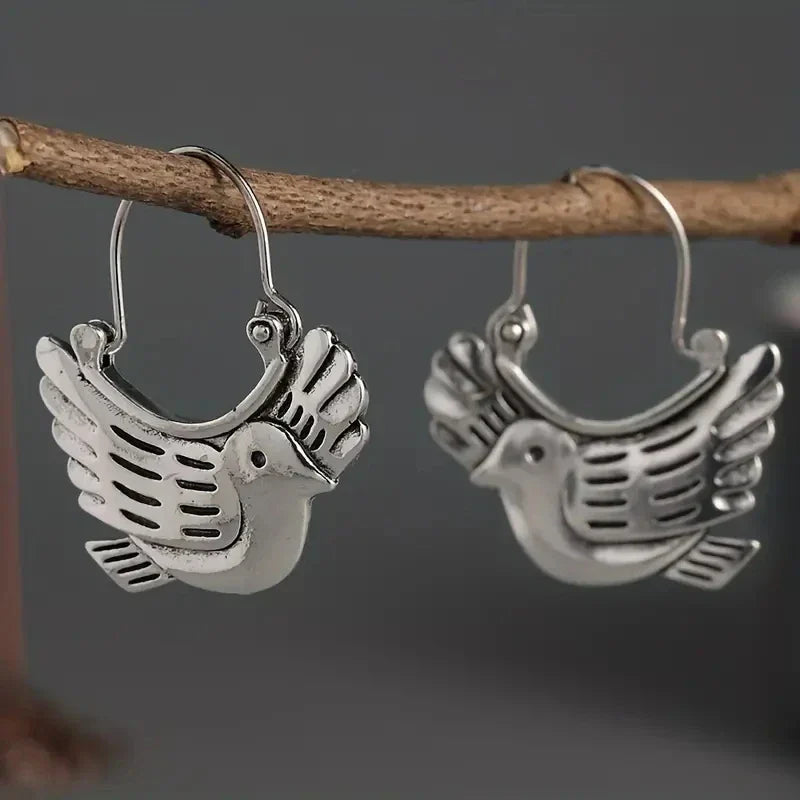 Boucles d'oreilles pendantes inspirées par un oiseau boho – couleur argentée