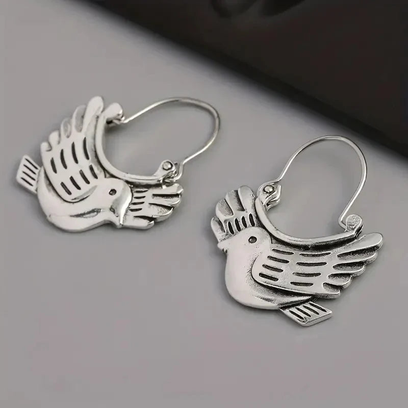 Boucles d'oreilles pendantes inspirées par un oiseau boho – couleur argentée