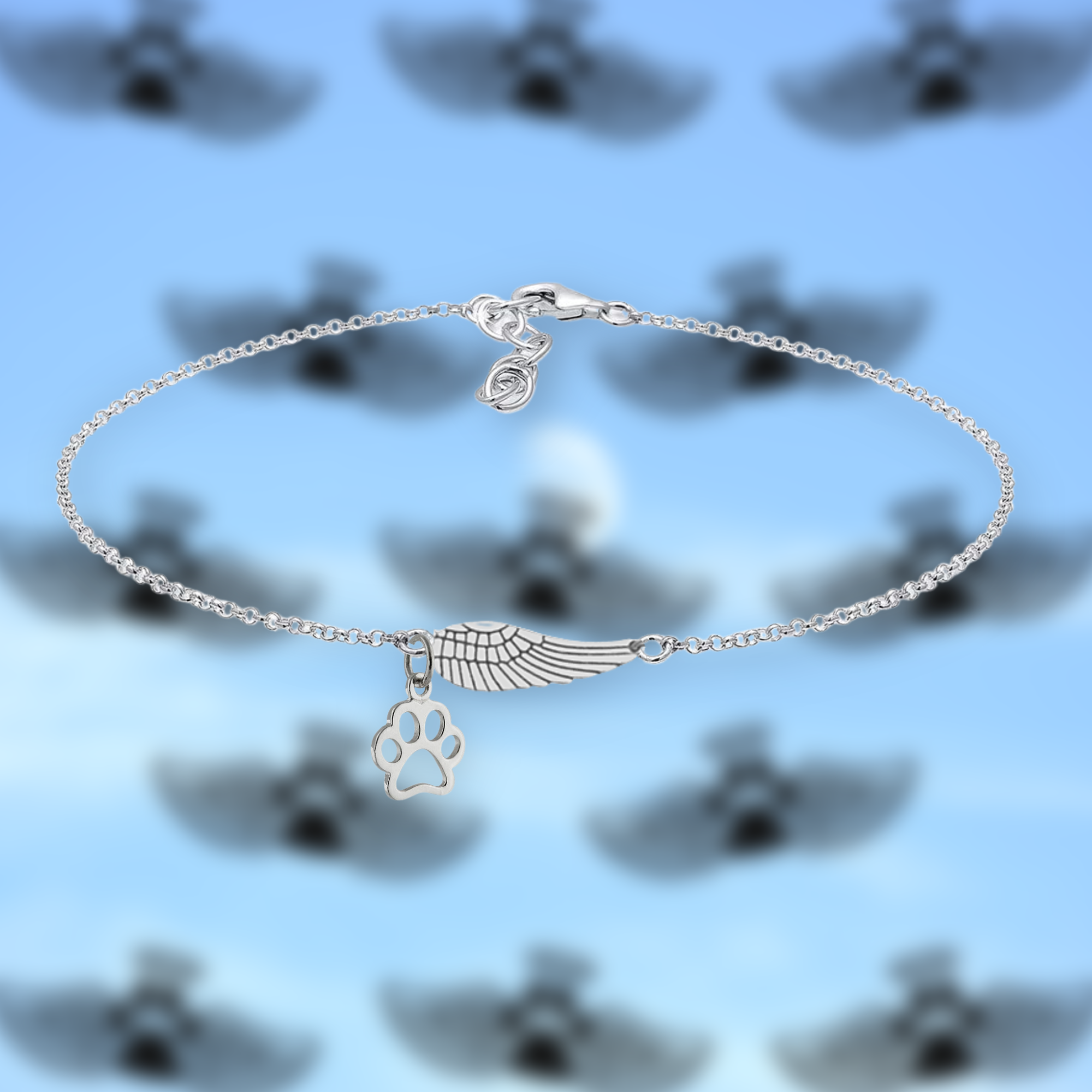 Bracelet souvenir argenté avec une aile d'ange et une patte, fait à la main