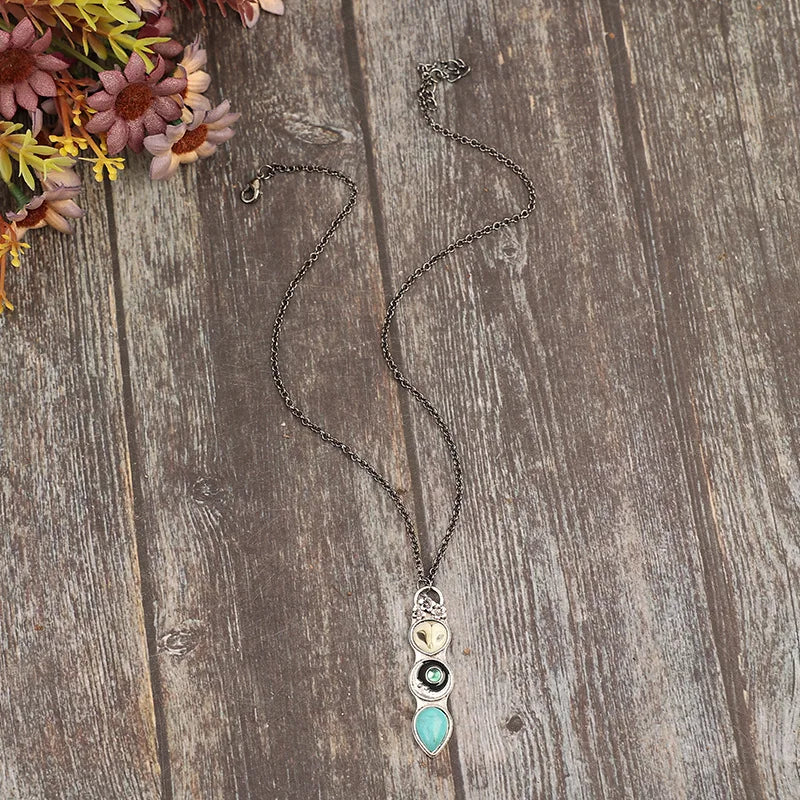 Collier barre avec un hibou turquoise de sagesse