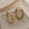 Boucles d'oreilles en forme de vague dorée | or