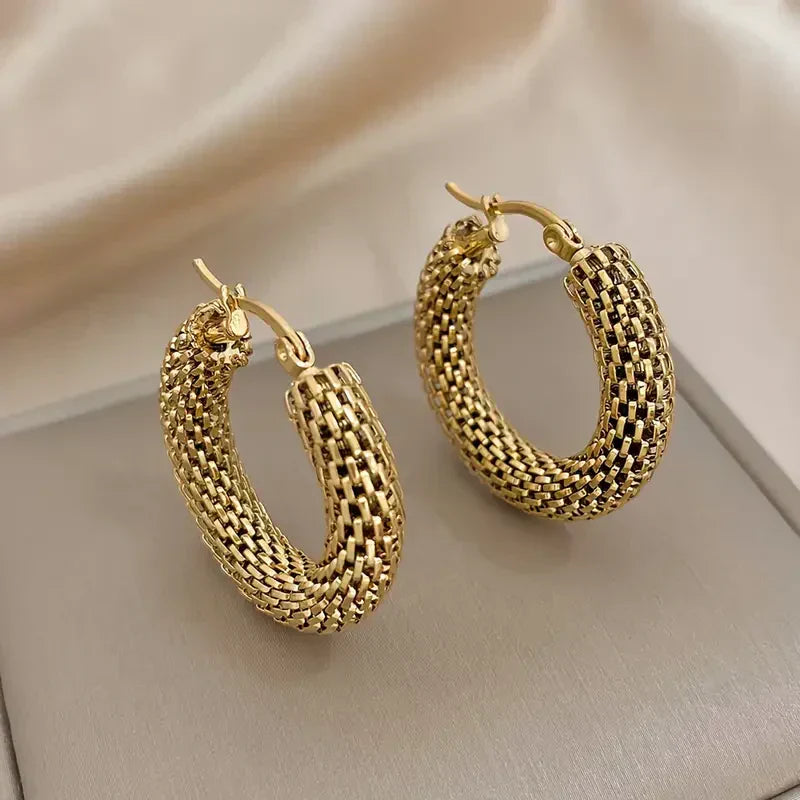 Boucles d'oreilles en forme de vague dorée | or