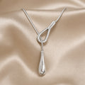 Collier Pendentif Goutte Vintage en Or Blanc