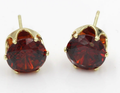 Puces d'oreilles rondes rubis